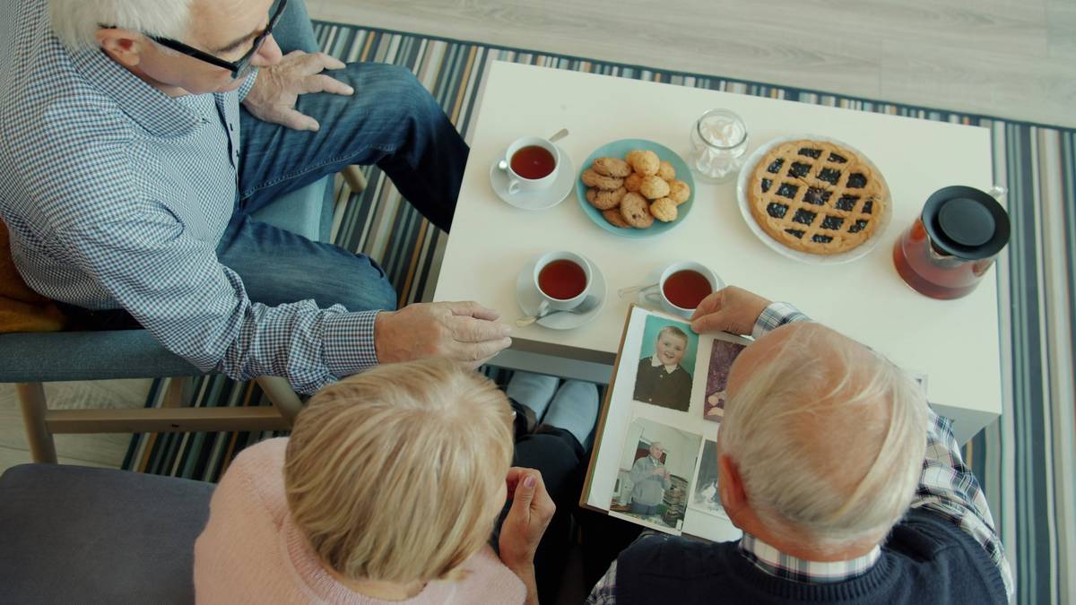 Family reviewing life and legacy planning documents together around a table